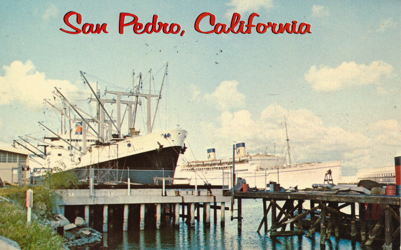 Freighter at dockside in Los Angeles Harbor, San Pedro, California. In the background is the U.S. Lurline departing for Hawaii